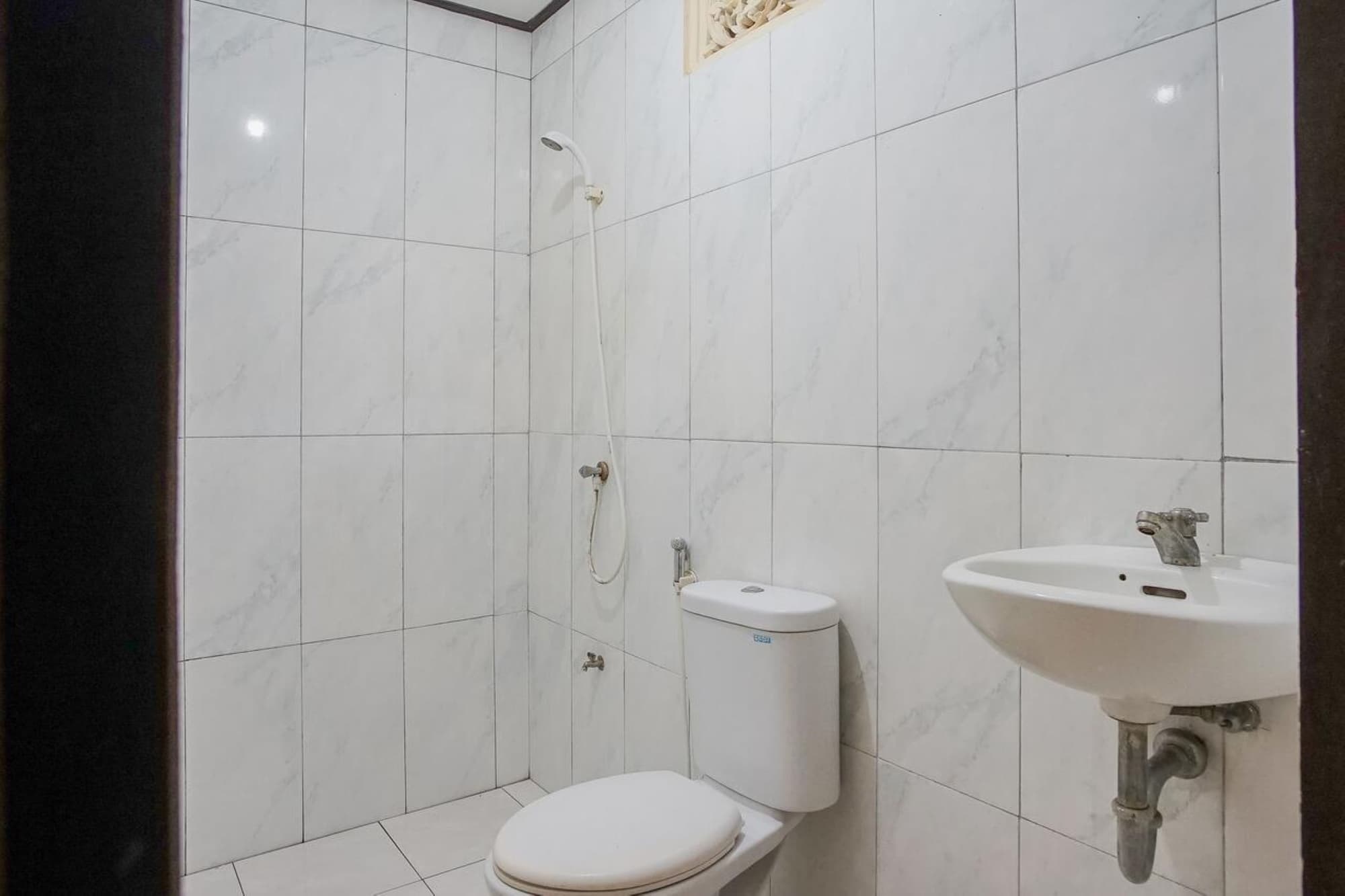 Mahendra Beach Inn by ZUZU, Room