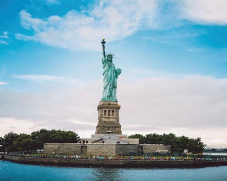 Statue of Liberty and the Immigration Museum at Ellis Island From New York
