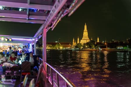 Evening dinner cruise on the Chao Phraya River with live shows and transfers
