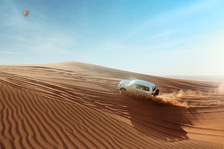 Desert Safari Dubai with Dune Bashing, Sandboarding, Camel Ride, 5 Shows, Dinner