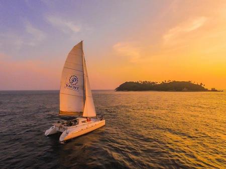 Coral Island and Sunset by Sailing Yacht Catamaran with Light Dinner - Half Day Tour